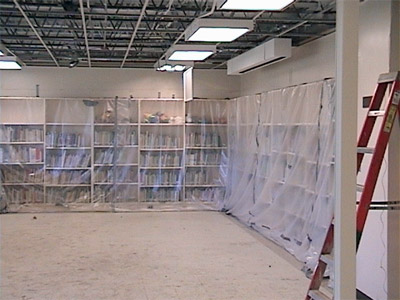 Bookcases and books protected during clean-up.