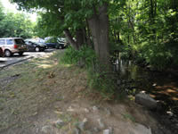 [Before Construction] View of Mill Brook and Hurd Field parking lot looking west