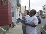 A member of the Lead Action Collaborative trains a group of volunteers to perform CATs in the neighborhoods of Dorchester, Roxbury, Hyde Park and Mattapan.