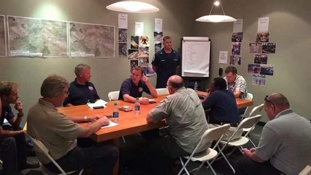 Area Command photo: Area Command staff from EPA and Coast Guard receive updates during a morning briefing