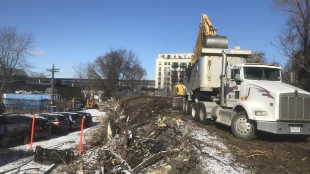 Loading contaminated soil onto truck for disposal 