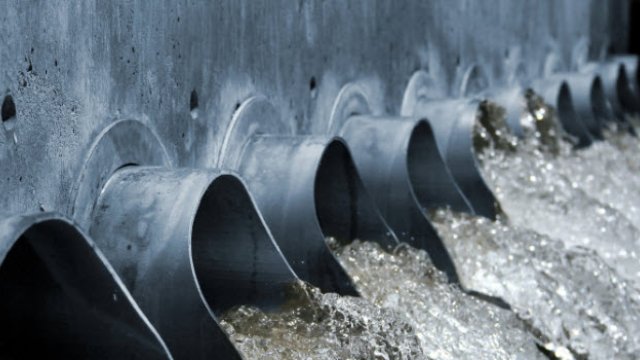 Water pouring out of large drains