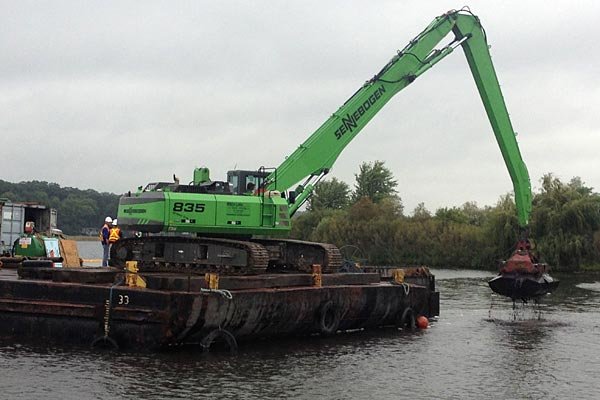 Construction crew removes contaminated sediment from White Lake.