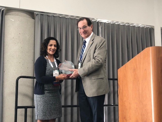 Dr. Wayne Cascio is presented with his award at APHA