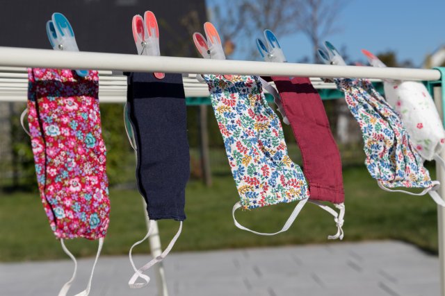 cloth masks drying on a clothesline