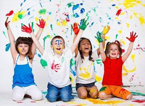 Children playing with fingerpaint