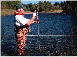 person monitoring river