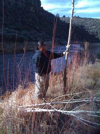 Picture of a guy standing in front of a river