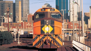 Locomotive with city skyline