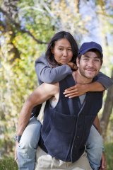 Young couple in Fall forest