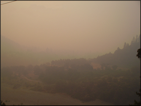 The image above shows hazardous air quality conditions during the Red Salmon Complex Fire in October 2020 in Hoopa Valley, CA. (Photo credit: Brian McCaughey)