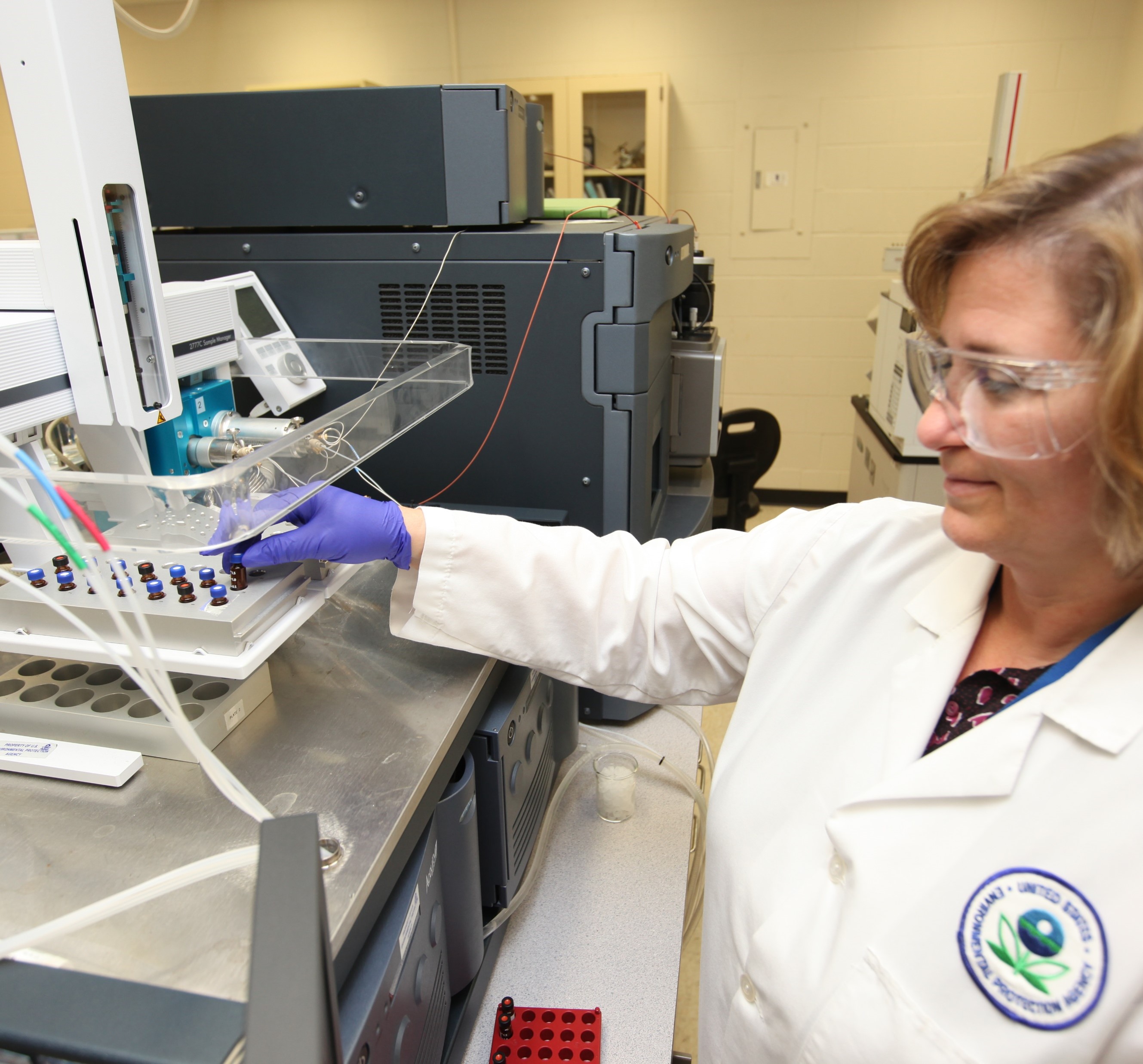 Woman scientist performing PFAS analytical method