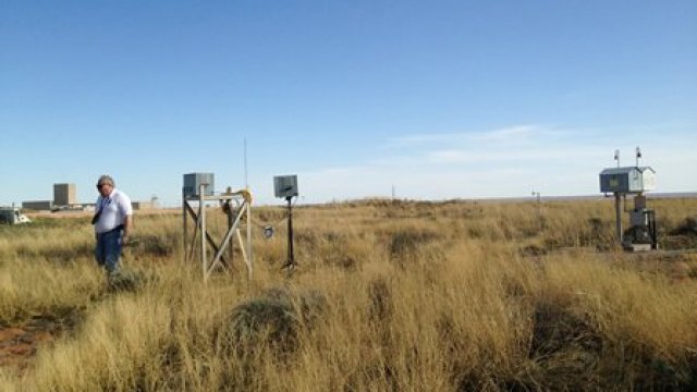 EPA air samplers (boxes on stands) and DOE air samplers (that look like little houses)