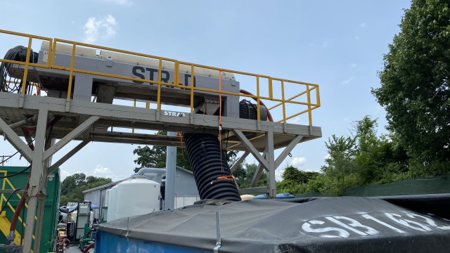 Huge machine called a cwentrifugre separates the solid waste