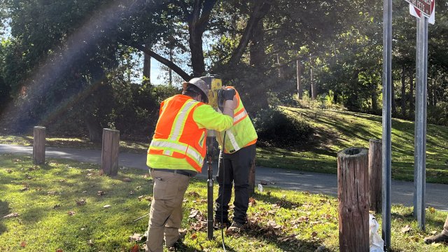 Workers taking soil samples in the East Palestine Village Park