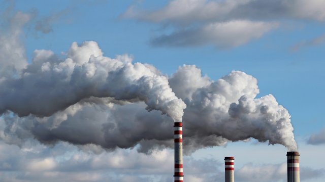 Emissions coming out of several industrial facility smokestacks