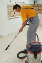 Person using a vaccuum cleaner