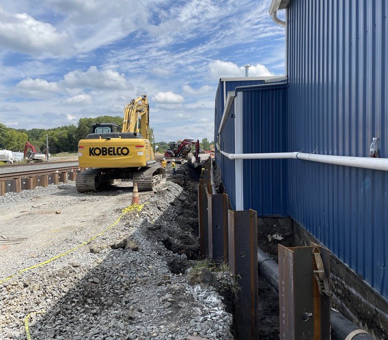 Excavation of contaminated soil alongside the CeramFab building