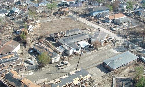 Photo of a neighborhood devastated by a natural disaster. 