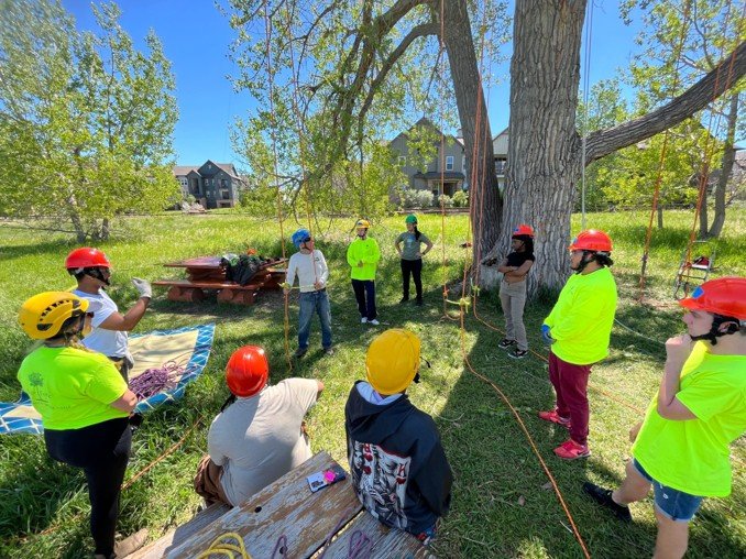 A previous GRIT program class learns how to professionally tree climb.