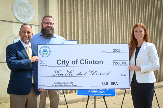 Ceremonial check presentation by Meg McCollister