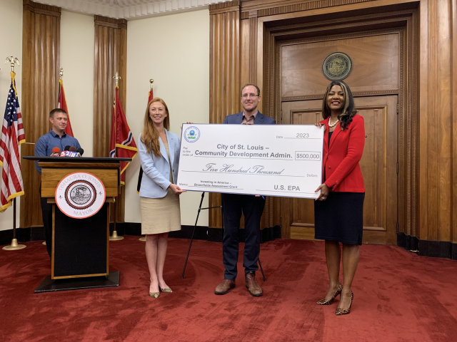 Group photo of ceremonial check presentation