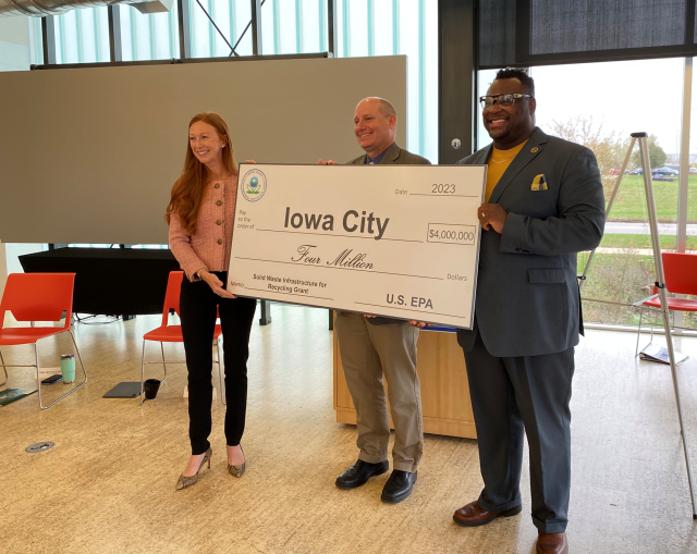 Group photo of ceremonial check presentation