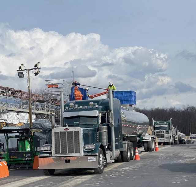 Trucks being loaded with non- hazardous water for off-site disposal