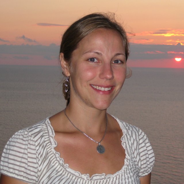 EPA Researcher Kiara Lech smiling in front of a sunset