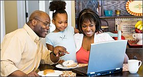 Family using a laptop together