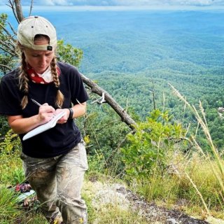 AJ Blackburn conducting field research in the mountains