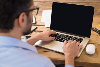 man working on laptop