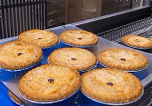 Pies on the facility conveyor belt. (Photo credit: MassLive)